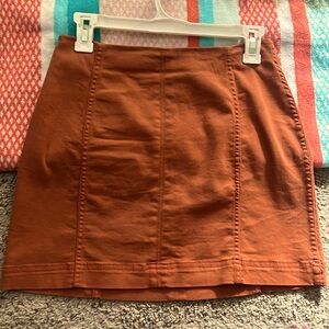 BRAND NEW rust colored skirt with zipper back